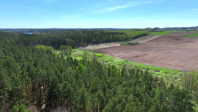 A drone view of the landscape of Warmia in the spring during field work, northern Poland, Europe