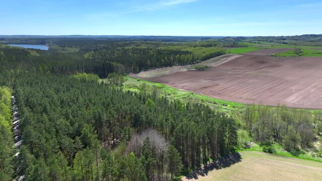 A drone view of the landscape of Warmia in the spring during field work, northern Poland, Europe
