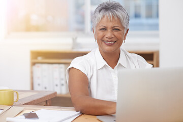 Portrait, laptop and senior woman in office smile for career management, digital administration and planning. Happy face of biracial business person, manager or employee working at desk on computer