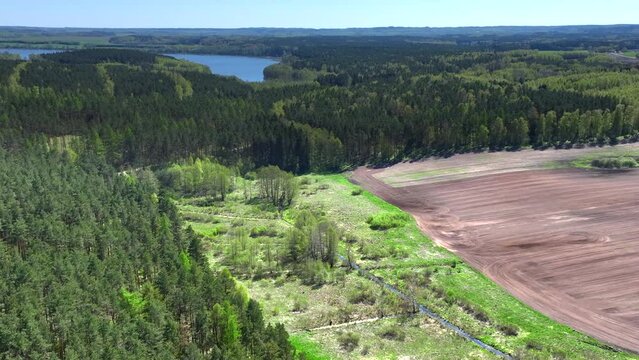 A drone view of the landscape of Warmia in the spring during field work, northern Poland, Europe