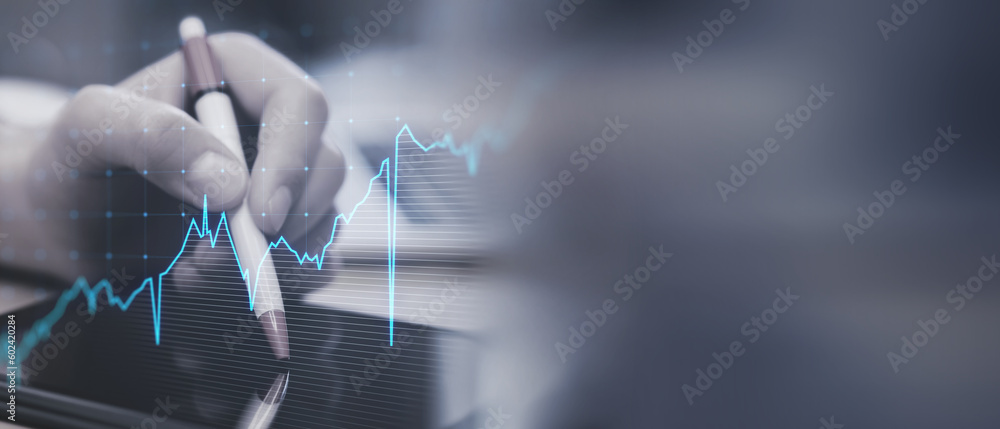 Aufkleber close up of hand using digital pad with glowing upward business chart on blurry wide perspective bac
