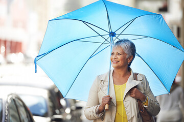 Walking, umbrella and senior happy woman on city commute, travel and smile on urban journey. Winter weather, happiness and female person looking at Mexico street view, commuting and walk on road - obrazy, fototapety, plakaty
