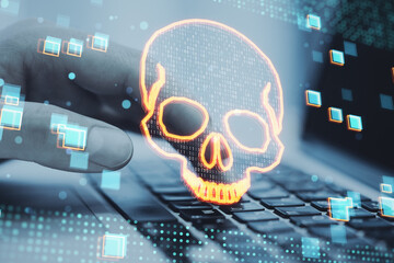 Close up of male hands using laptop keyboard with glowing digital binary code skull on blurry background. Hacking, piracy, malware and data theft concept. Double exposure.
