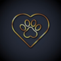 Gold line Heart with animals footprint icon isolated on black background. Pet paw in heart. Love to the animals. Vector