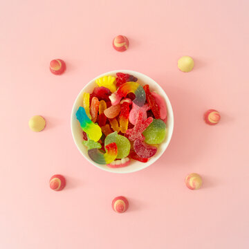 Creative background made of gummy candies. Colorful flat lay. Jelly sweets aesthetic. Minimal concept.