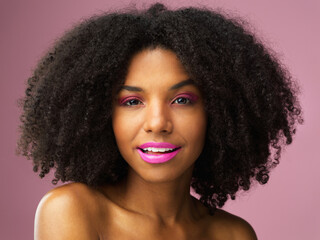 Face portrait, hair care and black woman with lipstick in studio isolated on a pink background for skincare. Beauty, makeup cosmetics and African female model with salon treatment for afro hairstyle.