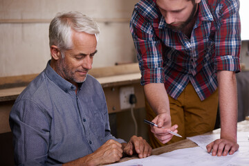 Architect, teamwork and men with blueprint in workshop for building construction. Senior engineer, father and son working on design, project and planning of apprentice and mentor with paperwork.