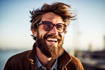 Laughing young man wearing a long hipster beard looking at the camera. Generative AI
