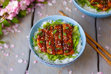 Pork Donburi. Delicious Japanese Rice Bowl with Tender Pork chops in Homemade Teriyaki Sauce served...
