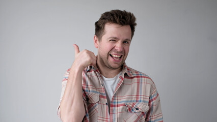 The European young man gives a thumbs up, approving the choice