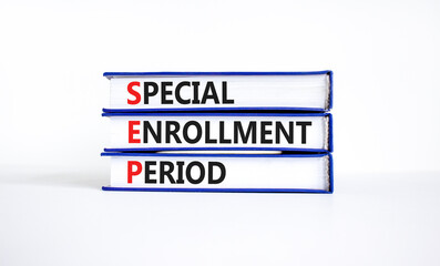 SEP symbol. Concept words SEP Special enrollment period on beautiful books. Beautiful white table...