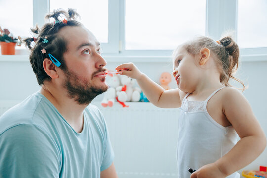 A Bearded Dad And His Daughter Sharing A Fun And Playful Moment While Putting On Makeup, With Funny Faces And Expressions. Dad's First Time Putting Makeup On His Daughter Goes Terribly Wrong