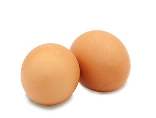 Two brown eggs from a chicken on a white background. Isolated. Photo in high quality.