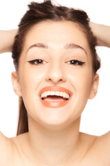 Obraz premium Beautiful girl close up studio portrait against white background.