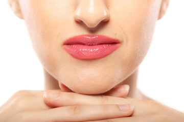 Beautiful girl abstract face close up studio portrait against white background.