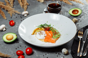 Summer healthy fastfood lunch, breakfast with Pancake with red fish, avocado and egg for breakfast. Aesthetic still life, healthy food concept