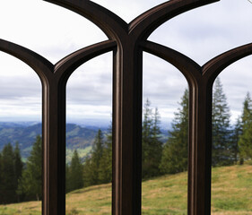 Fototapeta premium Rustic style window frame with hills and pine forest landscape background. 3d render.