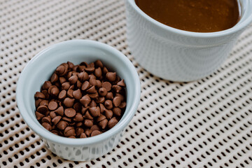 Chocolate in sprinkles and ingredients to prepare cake.