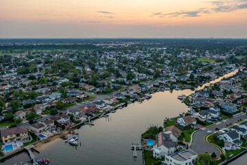 Merrick Long island at sunset aerial view bay homes canals boats orange