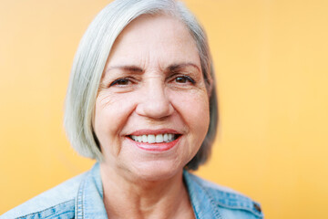 Portrait of Happy Senior woman smiling at camera - Focus on eyes