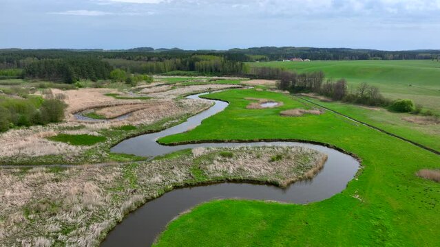 Top view of small river Lyna flowing in Warmia, northern Poland, Europe