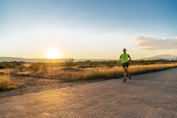 Obraz premium Triathlete in professional gear running early in the morning, preparing for a marathon, dedication to sport and readiness to take on the challenges of a marathon. 