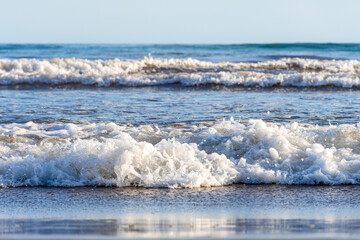 Waves breaking on the seashore.