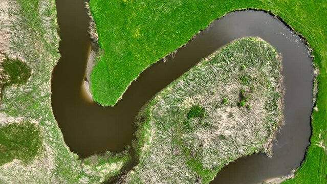 Top view of small river Lyna flowing in Warmia, northern Poland, Europe