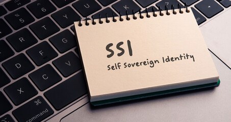 There is notebook with the word SSI Self Sovereign Identity.It is as an eye-catching image.