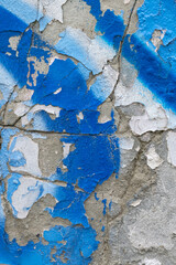 Painted white and blue old cracked wall