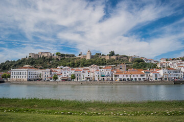 Lawn on the Sado river bank, city architecture and castle on the hill, Alcácer do Sal - PORTUGAL