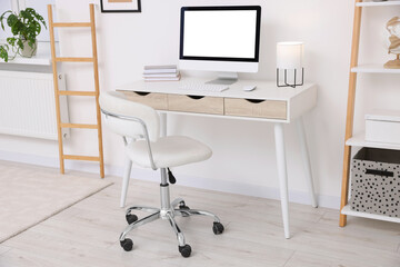Workplace with comfortable office chair indoors. Interior design
