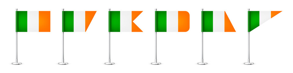 Realistic various Iriah table flags on a chrome steel pole. Souvenir from Ireland. Desk flag made of paper or fabric, shiny metal stand. Mockup for promotion and advertising. Vector illustration