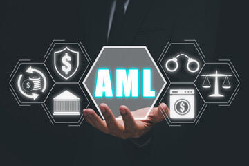 AML, Anti Money Laundering Financial Bank Business Concept, Person hand holding AML anti money...