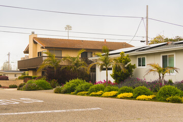 Beautiful houses with nicely landscaped front the yard in a small beach town somewhere in California