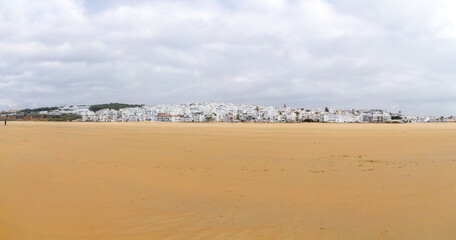 Fototapeta na wymiar Panoramic view of the beach and the whitewashed village of Conil de la Frontera, Cadiz, Andalusia, Spain