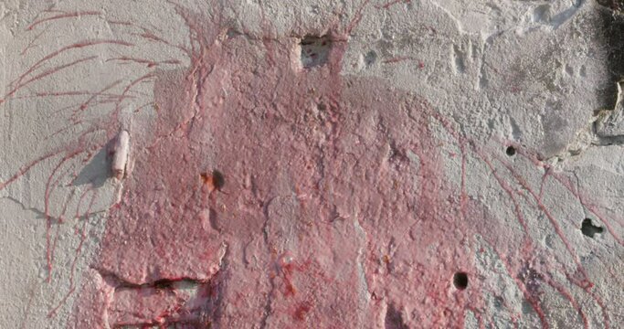 Mesmerizing slow motion, green glass bottle filled with red wine shatters against a rugged concrete wall, creating a captivating explosion of color and textures. Visual representation of power, beauty