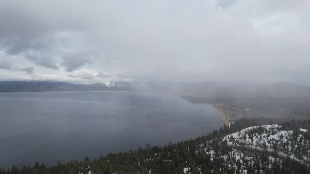 Aerial view of South Lake Tahoe on a cloudy and snowy day