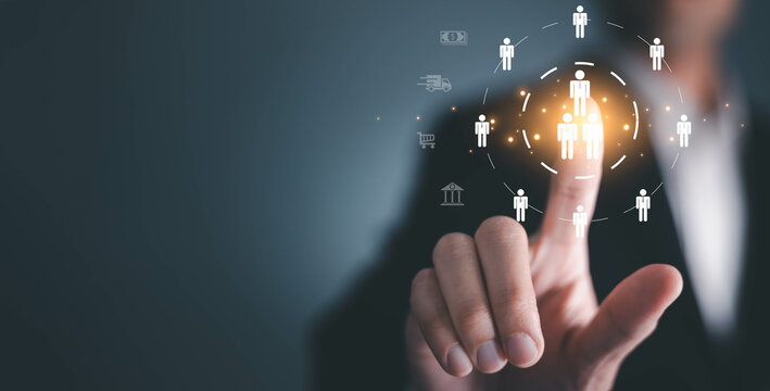 Businessman tuching human icon for business CRM or Customer Relation Management and customer focus target group concept, social media. Digital marketing online. HRM, human manage.