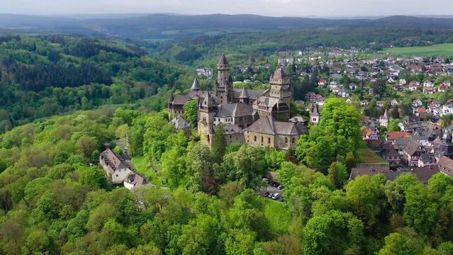 Aerial drone view medieval neo-gothic Braunfels castle on top of hill on gloomy rainy day. Hessen, Germany. High quality 4k footage