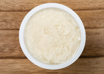 top view bowl of tofu syrup on wood background