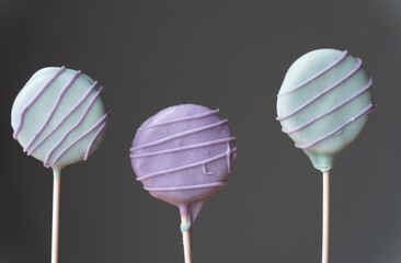 Colorful homemade cake pops with gray background
