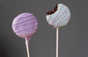 Colorful homemade cake pops with gray background