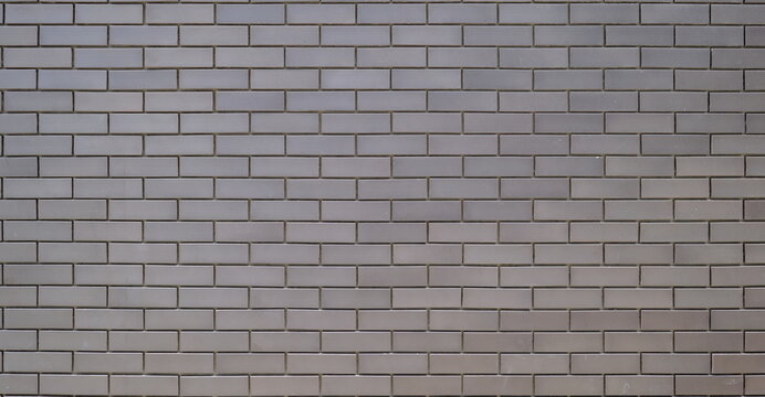 Fototapeta Exterior grey brick wall with regular shape