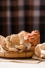 Fototapeta na wymiar Natural fresh pink oyster mushrooms are an ingredient in local cuisine