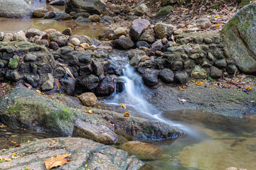 Kathu waterfall water gently flowing down the rocks Patong Phuket Thailand Asia