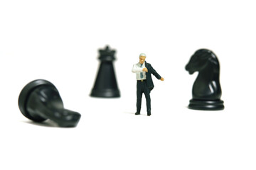 Miniature tiny people toy figure photography. Business preparation concept. A businessman getting...