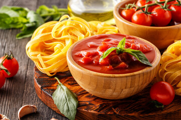 Products for cooking - tomato sauce, pasta, tomatoes, garlic, olive oi.