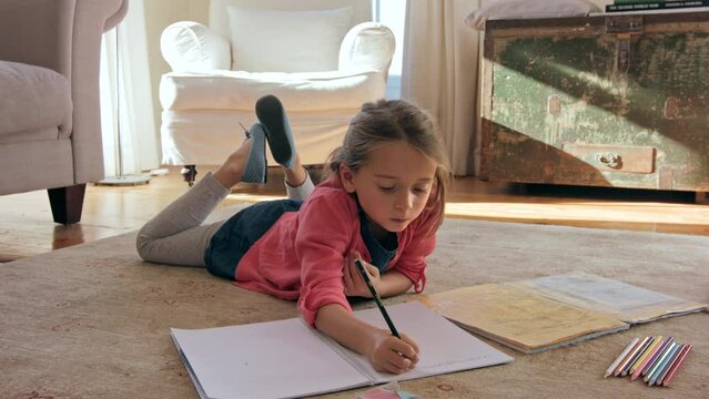 Child, learning and doing math for education, homework or development with kindergarten girl writing numbers in her home. Curious student kid counting during homeschool studying for distance learning