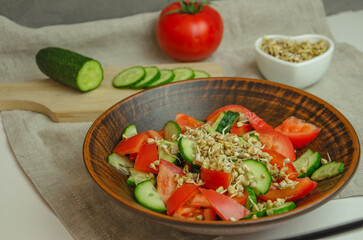 green buckwheat sprout salad, cucumbers and tomatoes